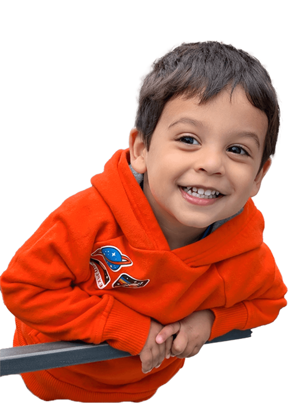 Giovanni smiling with orange sweatshirt